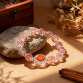 The 13-bead pink crystal glass prayer bracelet laid flat, made with natural materials for meditation and spiritual practice.