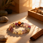 Multicolored glass beads bathed in light, a BodhiPulse reminder that life’s blessings are ever-present and flowing with grace in the now.