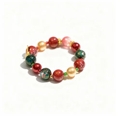BodhiPulse Heaven Harmony Bracelet with 12 golden pearls, red and green glazed glass beads, and delicate gold foil from The Seven Jewels Pure Land Collection.