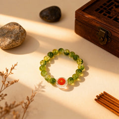A handmade 19-bead green glass prayer bracelet from BodhiPulse’s Seven Jewels Pure Land Collection, laid flat as a portable sanctuary.