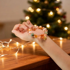 Holding the vibrant crystal bracelet in hand, a BodhiPulse tool for grounding, reflection, and connecting to inner calm.