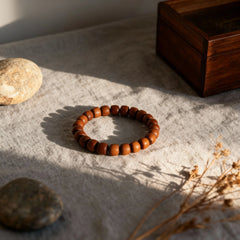 A minimalist sandalwood bracelet in soft light, embodying Oriental aesthetics and the philosophy of condensed, settled time.