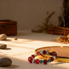 The BodhiPulse glass bracelet inspired by sea coral and ocean depths, with filtered light creating a tranquil, healing energy for meditation.
