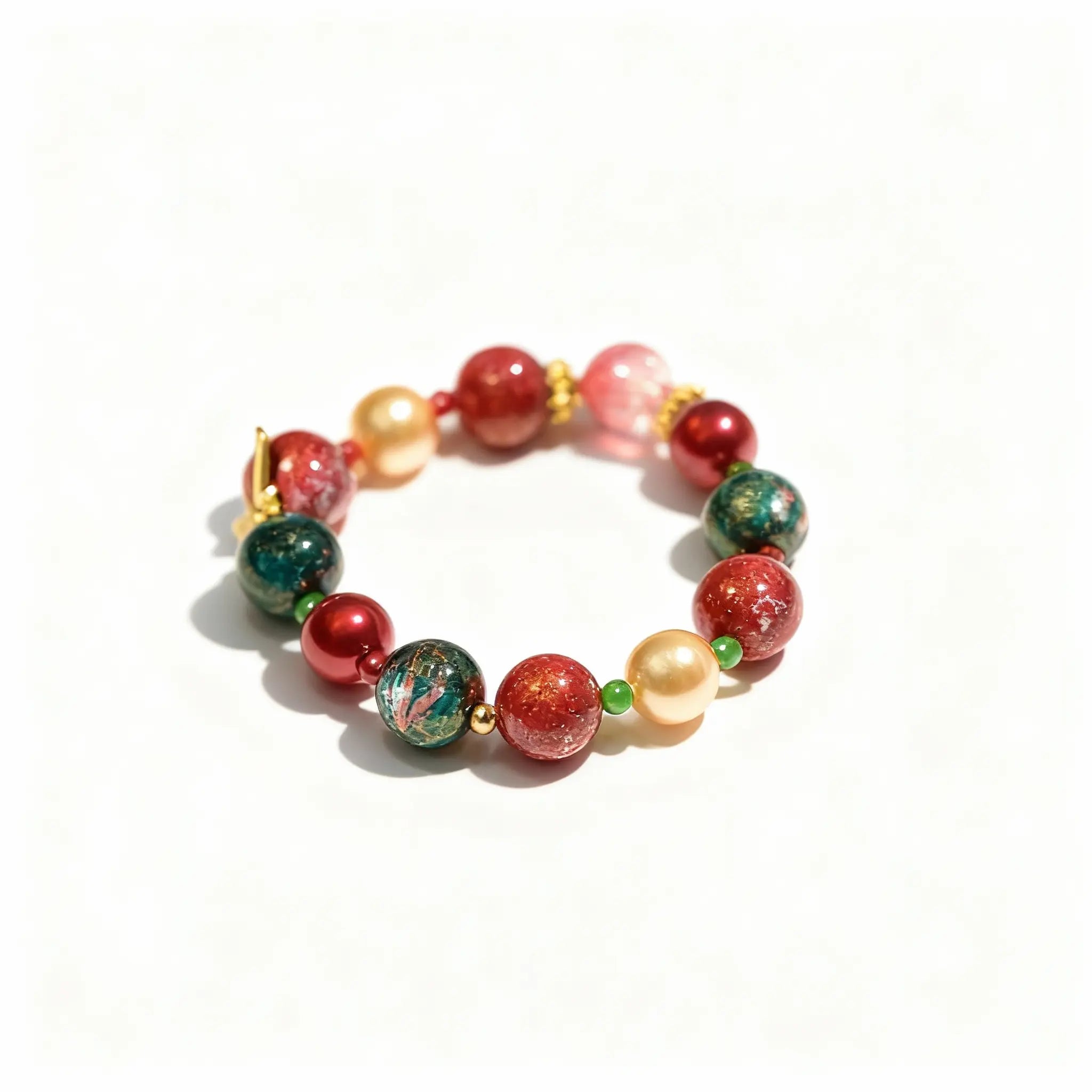 BodhiPulse Heaven Harmony Bracelet with 12 golden pearls, red and green glazed glass beads, and delicate gold foil from The Seven Jewels Pure Land Collection.