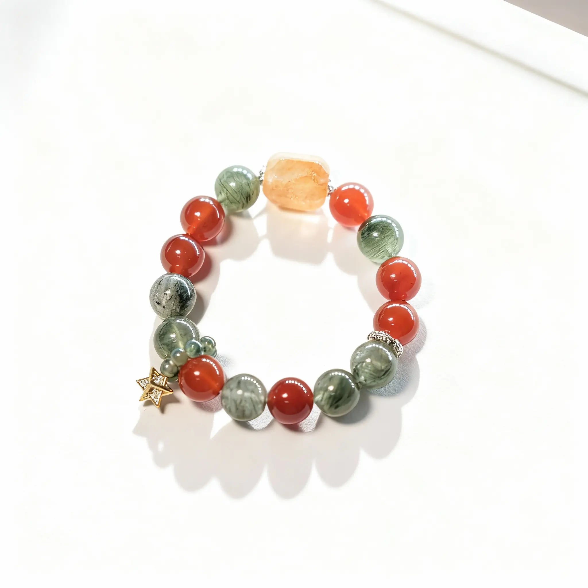 BodhiPulse‘Red Agate - Bedrock’bracelet with 15 red agate & green crystal beads and a hexagonal centerpiece, for grounding energy and balance.