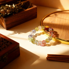 Colorful natural crystals of the bracelet reflecting light, symbolizing the harmonious balance and tranquil energy of the present moment.