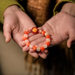 Gently cradling the ‘Quiet Warmth’ crystal bracelet in both hands, receiving its blessings for a tranquil heart and balanced energy from BodhiPulse.