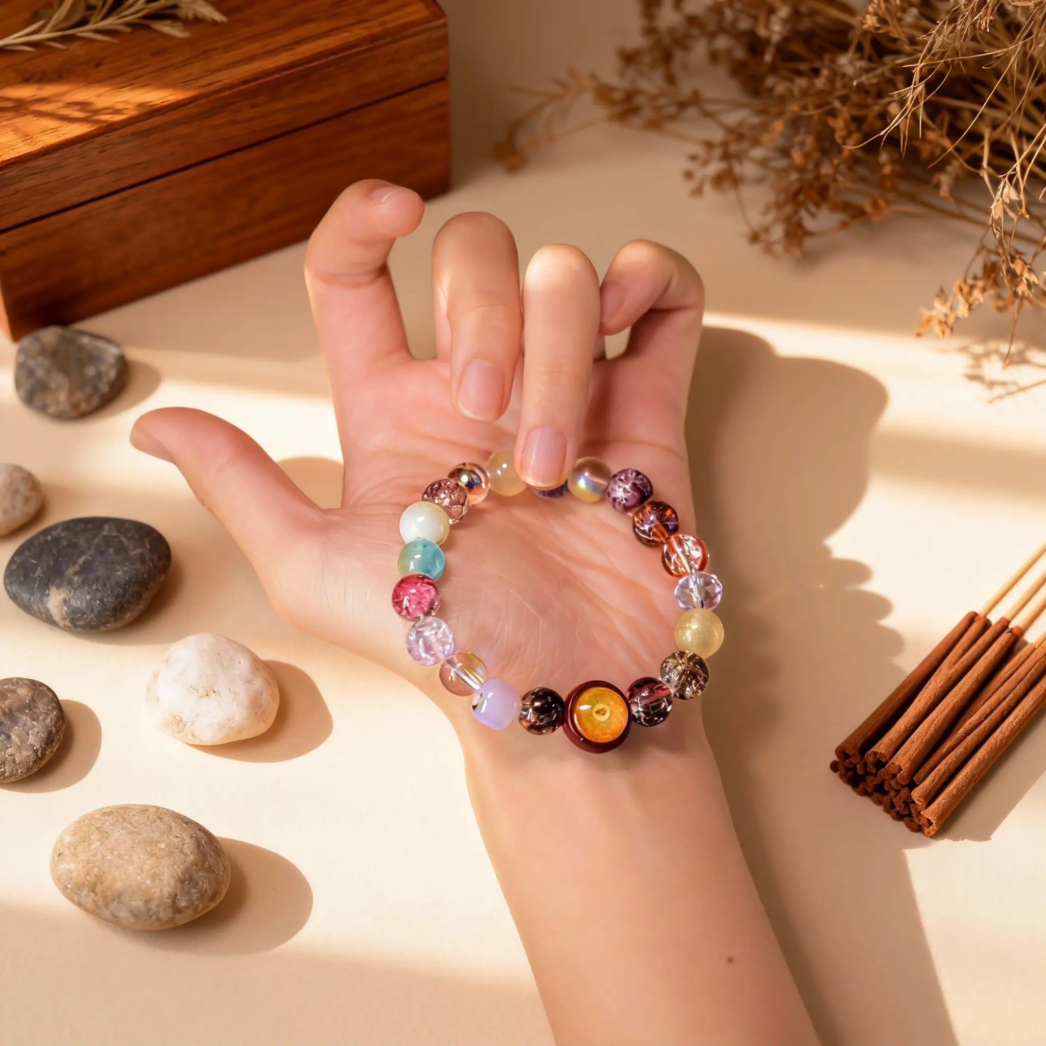 Holding the ‘Auspicious Clouds Flowing’ bracelet in hand, a personal BodhiPulse tool for fostering openness, clarity, and connection to positive energy.