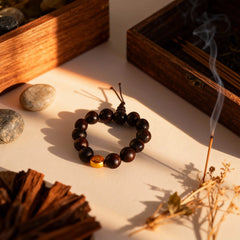 The single-strand soapberry bracelet laid out, embodying the ease and fearless openness of energy moving like a clear mountain stream.