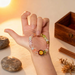 Holding the ‘Pure Resonance’ crystal bracelet in hand, a BodhiPulse tool for grounding and mindful meditation in the present moment.