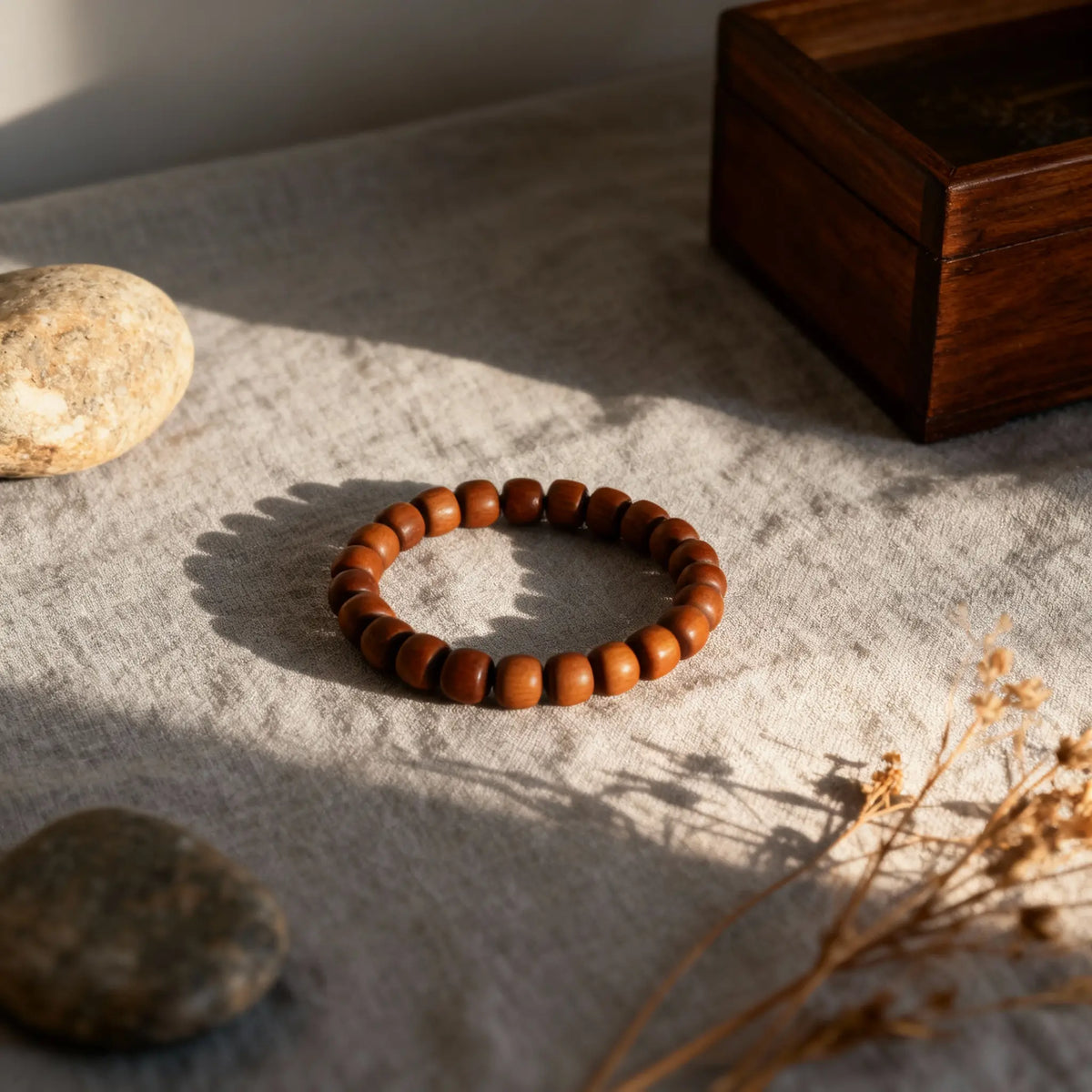 A minimalist sandalwood bracelet in soft light, embodying Oriental aesthetics and the philosophy of condensed, settled time.