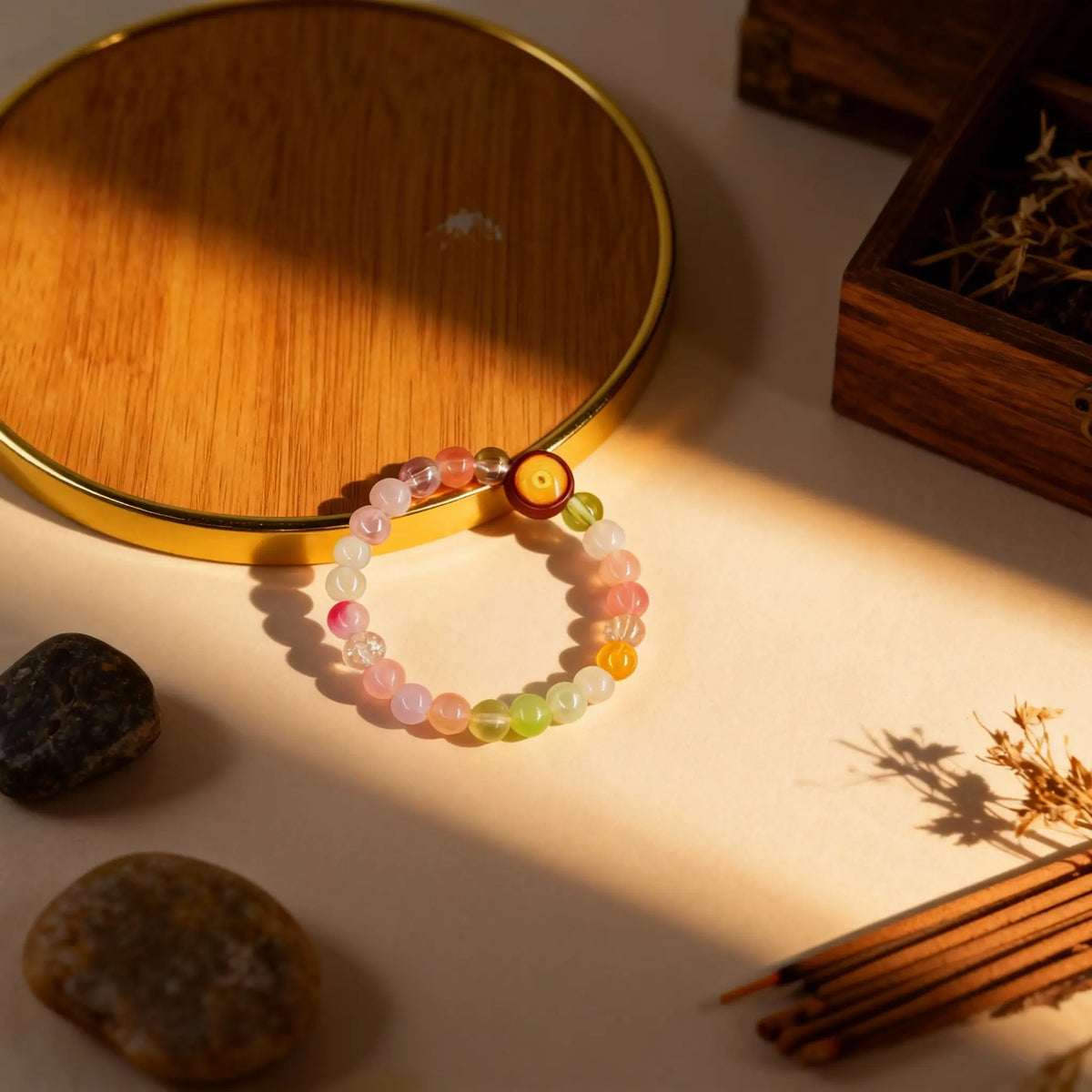 The precious crystal bracelet arranged to showcase its harmonious blend of colors, symbolizing serenity and the gentle glow of moonlight.