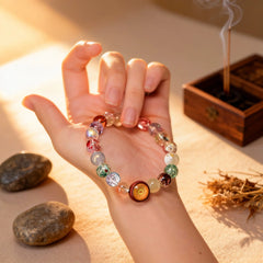 The vibrant ‘Radiant Embrace’ bracelet resting in the palm, a BodhiPulse tool for mindfulness and receptivity to fortune in the present moment.