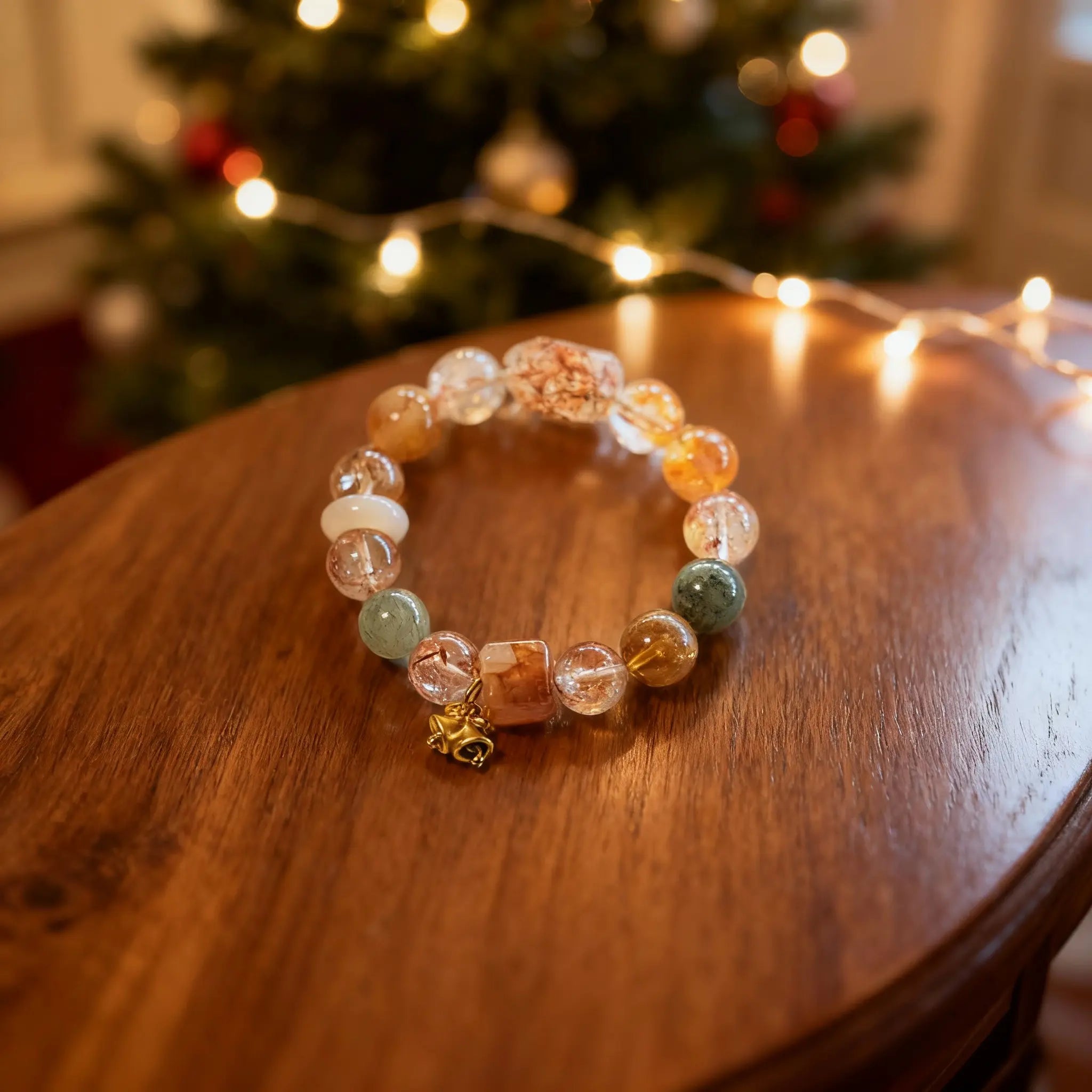 The ‘Flowing Light’ bracelet on wood, showcasing unique stone markings in orange, red, and green natural crystals for vitality and peace.