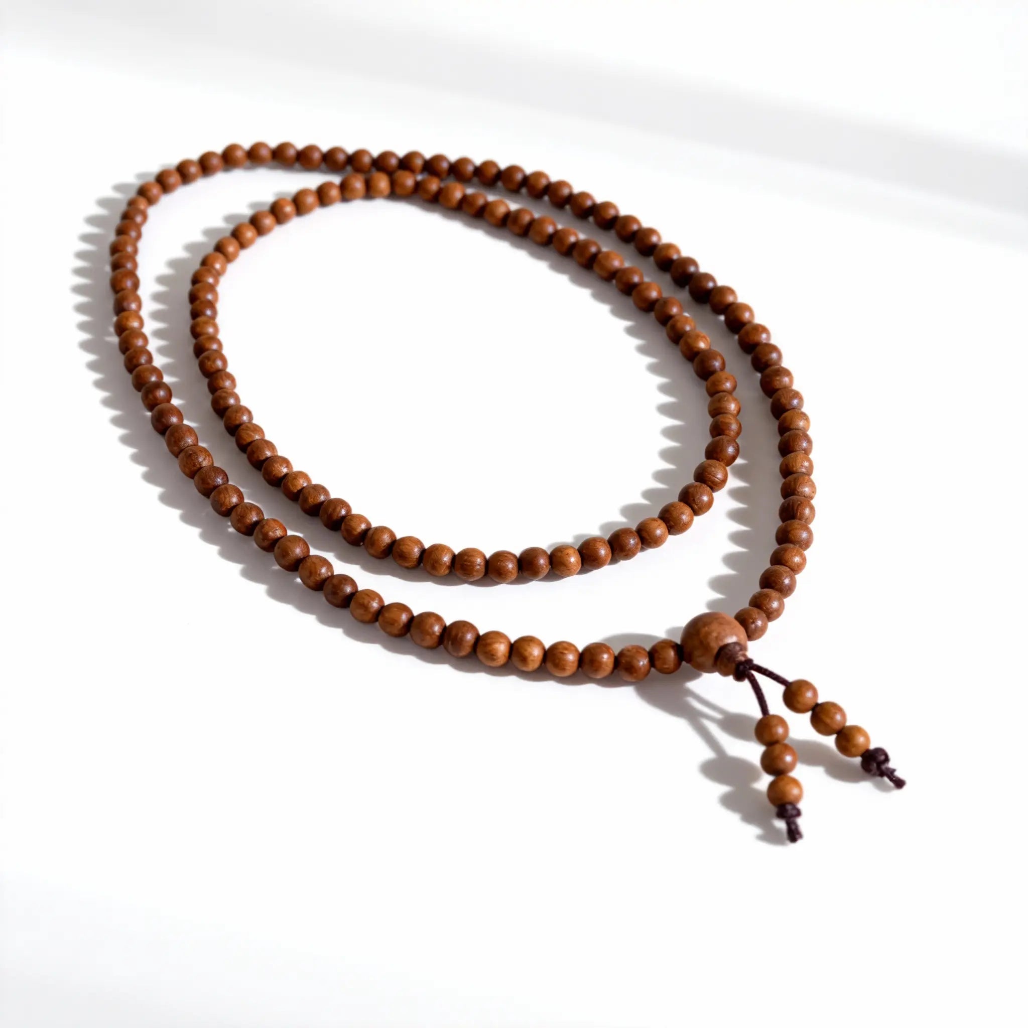 The ‘Overlapping Universes’ mala in a double-loop formation, embodying the concept of personal time intersecting with the vast and enduring.