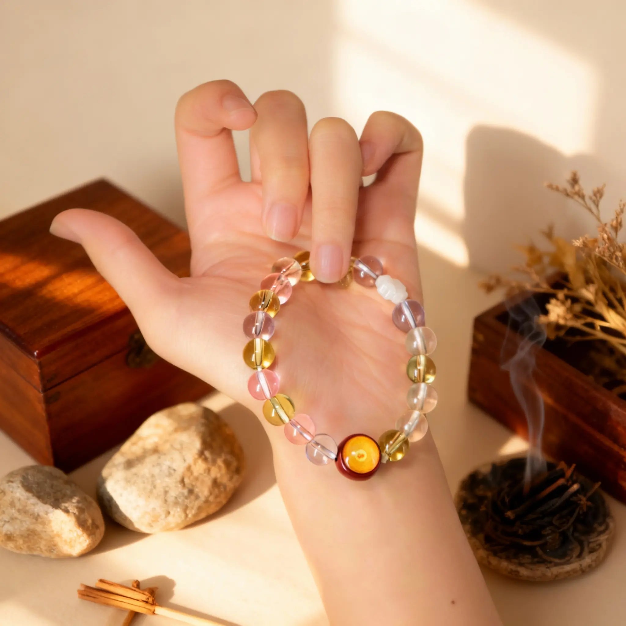 Holding the Pure Crystal bracelet in hand, a BodhiPulse tool for grounding and connecting to the clarity of the present moment.