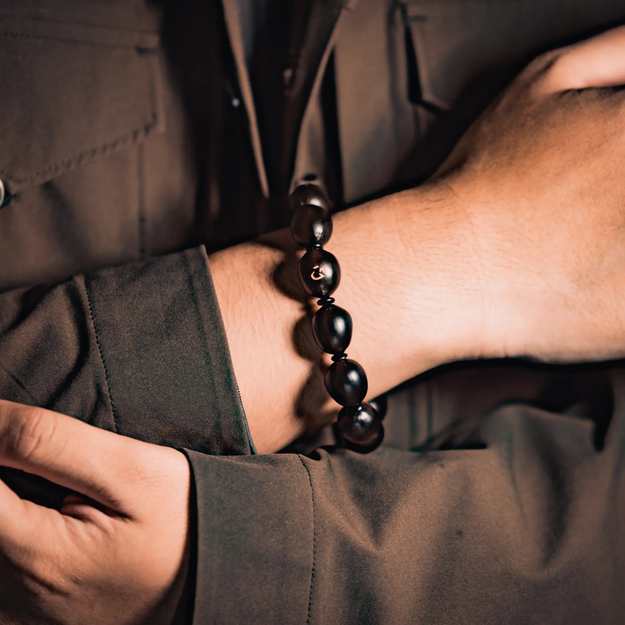 Wearing the handmade BodhiPulse lotus seed mala bracelet for meditation and composure