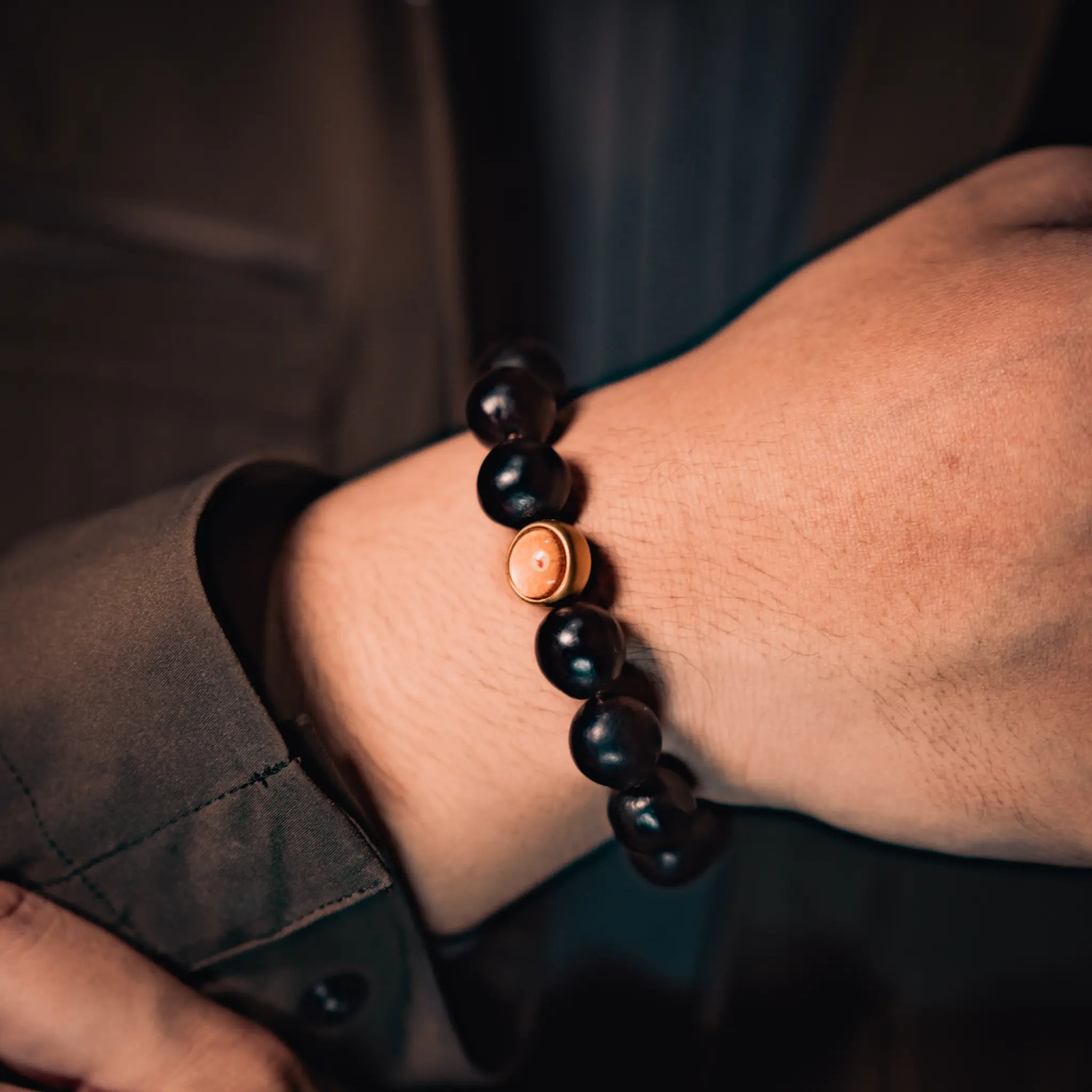 The BodhiPulse soapberry bracelet worn on wrist, a subtle form of awareness and a daily companion for clarity in moments of choice.